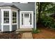Charming home entrance with white trim, bay window, and well-maintained landscaping at 3001 Majestic Park Ct, Duluth, GA 30096
