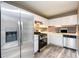 Updated kitchen features stainless steel appliances, white cabinetry, and modern countertops at 3001 Majestic Park Ct, Duluth, GA 30096