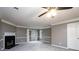 Comfortable living area with a fireplace, plush carpeting, and a ceiling fan at 3001 Majestic Park Ct, Duluth, GA 30096