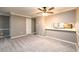 Cozy living room featuring neutral paint, plush carpeting, and an open view to the kitchen at 3001 Majestic Park Ct, Duluth, GA 30096