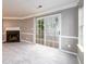 Cozy living room with a fireplace and sliding glass doors to the outside at 3001 Majestic Park Ct, Duluth, GA 30096