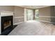 Spacious living room featuring a fireplace and sliding glass doors at 3001 Majestic Park Ct, Duluth, GA 30096