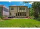 A spacious backyard with a deck and patio provides ample space for outdoor enjoyment at 3680 Milton Park Dr, Alpharetta, GA 30022