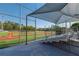 Community baseball field with green outfield and covered bleachers at 3680 Milton Park Dr, Alpharetta, GA 30022