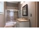 Cozy bathroom with a tub and shower combo, granite counter and modern fixtures at 3680 Milton Park Dr, Alpharetta, GA 30022