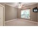 This cozy bedroom features a ceiling fan, window for natural light, and neutral-colored walls at 3680 Milton Park Dr, Alpharetta, GA 30022