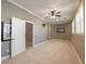 Bonus room with neutral paint and carpet, ceiling fan, and natural lighting at 3680 Milton Park Dr, Alpharetta, GA 30022