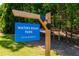 Waters Road Park community sign with natural wood frame and bright blue sign at 3680 Milton Park Dr, Alpharetta, GA 30022