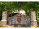 A stone entrance welcomes you to Hampshire Manor with a stately community sign at 3680 Milton Park Dr, Alpharetta, GA 30022