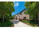 Beautiful, sprawling home featuring a long driveway and exquisite brickwork with professionally landscaped grounds at 3680 Milton Park Dr, Alpharetta, GA 30022