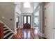 Elegant foyer with soaring ceilings, hardwood floors, and beautiful doors at 3680 Milton Park Dr, Alpharetta, GA 30022