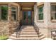 Stately brick home with a beautiful front entrance and meticulous landscaping at 3680 Milton Park Dr, Alpharetta, GA 30022