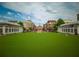 Community green space surrounded by shops and apartments at 3680 Milton Park Dr, Alpharetta, GA 30022