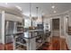 Beautiful kitchen with stainless steel appliances, large island with barstool seating and plenty of storage at 3680 Milton Park Dr, Alpharetta, GA 30022