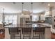 Spacious kitchen with granite counters, large island with seating, and stainless steel appliances at 3680 Milton Park Dr, Alpharetta, GA 30022