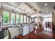 Bright living room featuring hardwood floors, large windows and a fireplace at 3680 Milton Park Dr, Alpharetta, GA 30022