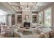 Cozy living room featuring a fireplace, custom built-ins, and ample seating at 3680 Milton Park Dr, Alpharetta, GA 30022