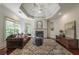 Sitting room showcasing a fireplace, built-in shelving, and a comfortable seating area at 3680 Milton Park Dr, Alpharetta, GA 30022