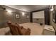 Theater room complete with projector screen, projector, seating, and speakers at 3680 Milton Park Dr, Alpharetta, GA 30022