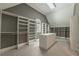 View of the walk-in closet with custom shelving and drawers at 3680 Milton Park Dr, Alpharetta, GA 30022