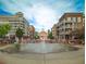 Community water fountain surrounded by shops and apartments at 3680 Milton Park Dr, Alpharetta, GA 30022