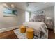 Comfortable bedroom with plush bedding, accent wall art, and grey decor at 44 Barbara Ln, Atlanta, GA 30327