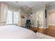 Comfortable bedroom with hardwood floors, a cozy seating area, and an attached bathroom for convenience at 44 Barbara Ln, Atlanta, GA 30327