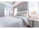 Serene bedroom featuring a plush white bed, soft lighting, and a stylish, comfortable aesthetic at 44 Barbara Ln, Atlanta, GA 30327