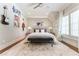 Fun bedroom with guitar decorations, plush bed, and neutral colors creating a perfect space for a music lover at 44 Barbara Ln, Atlanta, GA 30327