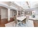 Elegant dining room with hardwood floors, modern chandelier, and coffered ceilings at 44 Barbara Ln, Atlanta, GA 30327
