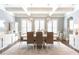 Open dining room with modern chandelier, window shutters, and display cabinet at 44 Barbara Ln, Atlanta, GA 30327