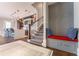 Stylish entryway with a built-in bench, hardwood floors, and a view into the modern kitchen at 44 Barbara Ln, Atlanta, GA 30327