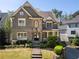 Charming two-story home featuring a combination of stone and shake siding with manicured landscaping at 44 Barbara Ln, Atlanta, GA 30327