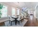 Dining room with a foyer in the background and staircase with a wooden bannister at 44 Barbara Ln, Atlanta, GA 30327