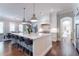 Open-concept kitchen featuring a large island with seating and stainless steel appliances at 44 Barbara Ln, Atlanta, GA 30327