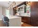 Kitchen featuring a marble countertop island with seating and modern pendant lighting at 44 Barbara Ln, Atlanta, GA 30327