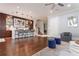 Open-concept living room with hardwood floors, bar, and modern lighting at 44 Barbara Ln, Atlanta, GA 30327