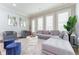 Bright living room with a grey sectional sofa, accent chairs, and modern decor at 44 Barbara Ln, Atlanta, GA 30327