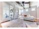 Bright living room with fireplace, wood beam ceiling, and access to the exercise room at 44 Barbara Ln, Atlanta, GA 30327