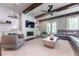 Stylish living room with a modern fireplace, beamed ceiling, and comfortable seating at 44 Barbara Ln, Atlanta, GA 30327