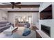 Open-concept living area with a fireplace, hardwood floors, and a view of the kitchen at 44 Barbara Ln, Atlanta, GA 30327