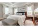 Serene main bedroom with tray ceilings, white draperies, and a stylish bed at 44 Barbara Ln, Atlanta, GA 30327
