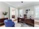Bright office with a large desk, hardwood floors, and an open view of the bathroom at 44 Barbara Ln, Atlanta, GA 30327