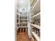 Well-organized pantry with shelving, storage containers, and hardwood floors adds convenience and style at 44 Barbara Ln, Atlanta, GA 30327