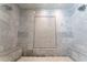 Luxurious walk-in shower with beautiful marble tiling, built-in benches, and dual shower heads at 44 Barbara Ln, Atlanta, GA 30327