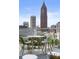 Balcony with a table, chairs, and stunning city views at 45 Ivan Allen Jr Nw Blvd # 1702, Atlanta, GA 30308