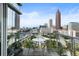 Balcony with a table, chairs, and stunning city views at 45 Ivan Allen Jr Nw Blvd # 1702, Atlanta, GA 30308