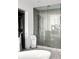 Modern bathroom featuring a glass-enclosed shower, tile flooring, and a walk-in closet at 45 Ivan Allen Jr Nw Blvd # 1702, Atlanta, GA 30308