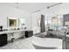 Bright bathroom with dual sinks, modern fixtures, soaking tub and glass wall bedroom view at 45 Ivan Allen Jr Nw Blvd # 1702, Atlanta, GA 30308