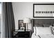 Chic bedroom with dark wood accents, plush bedding and large windows at 45 Ivan Allen Jr Nw Blvd # 1702, Atlanta, GA 30308
